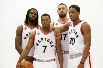 Sep 28, 2015; Toronto, Ontario, Canada; Toronto Raptors forward DeMarre Carroll (5) centre Jonas Valanciunas (17)  guard Kyle Lowry (7) and  guard DeMar DeRozan (10) during the media day at the Air Canada Centre. Mandatory Credit: Peter Llewellyn-USA TODA