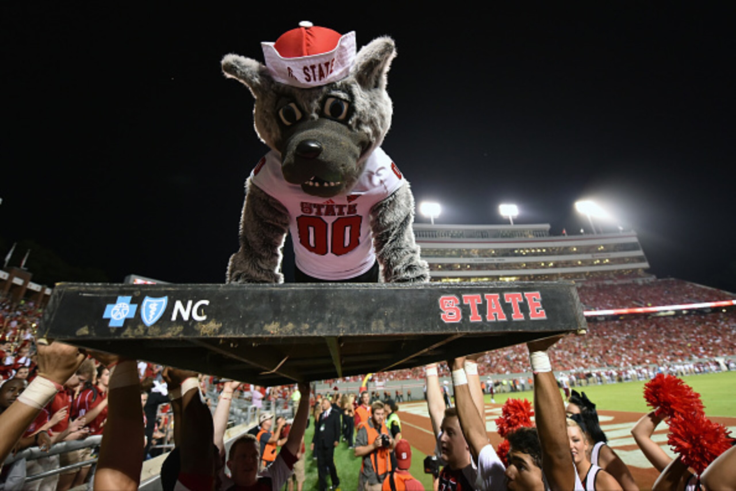 RALEIGH, NC - SEPTEMBER 05: The mascot of the North Carolina State Wolfpack does push-ups following an NC State touchdown against the Troy Trojans at Carter-Finley Stadium on September 5, 2015 in Raleigh, North Carolina. NC State defeated Troy 49-21. (Pho