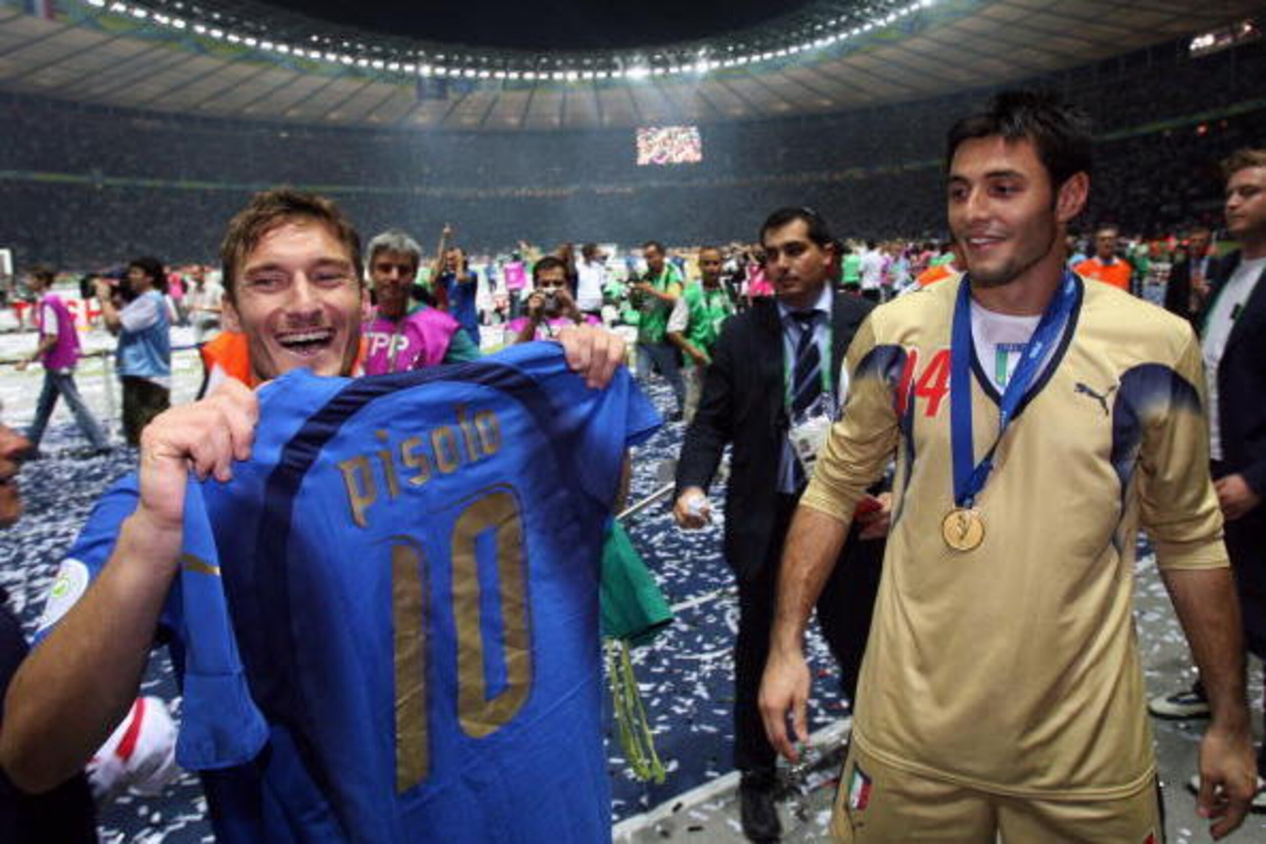 Berlin, GERMANY: Italian midfielder Francesco Totti (L) and Italian goalkeeper Marco Amelia (R) celebrate their victory in the World Cup 2006 final football match between Italy and France at Berlin's Olympic Stadium, 09 July 2006. Italy won 5-4 in a pen Berlin, GERMANY: Italian midfielder Francesco Totti (L) and Italian goalkeeper Marco Amelia (R) celebrate their victory in the World Cup 2006 final football match between Italy and France at Berlin's Olympic Stadium, 09 July 2006. Italy won 5-4 in a pen