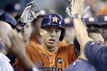 The small-budget Houston Astros are in the thick of the playoff race thanks to a young core that includes AL Rookie of the Year contender Carlos Correa.