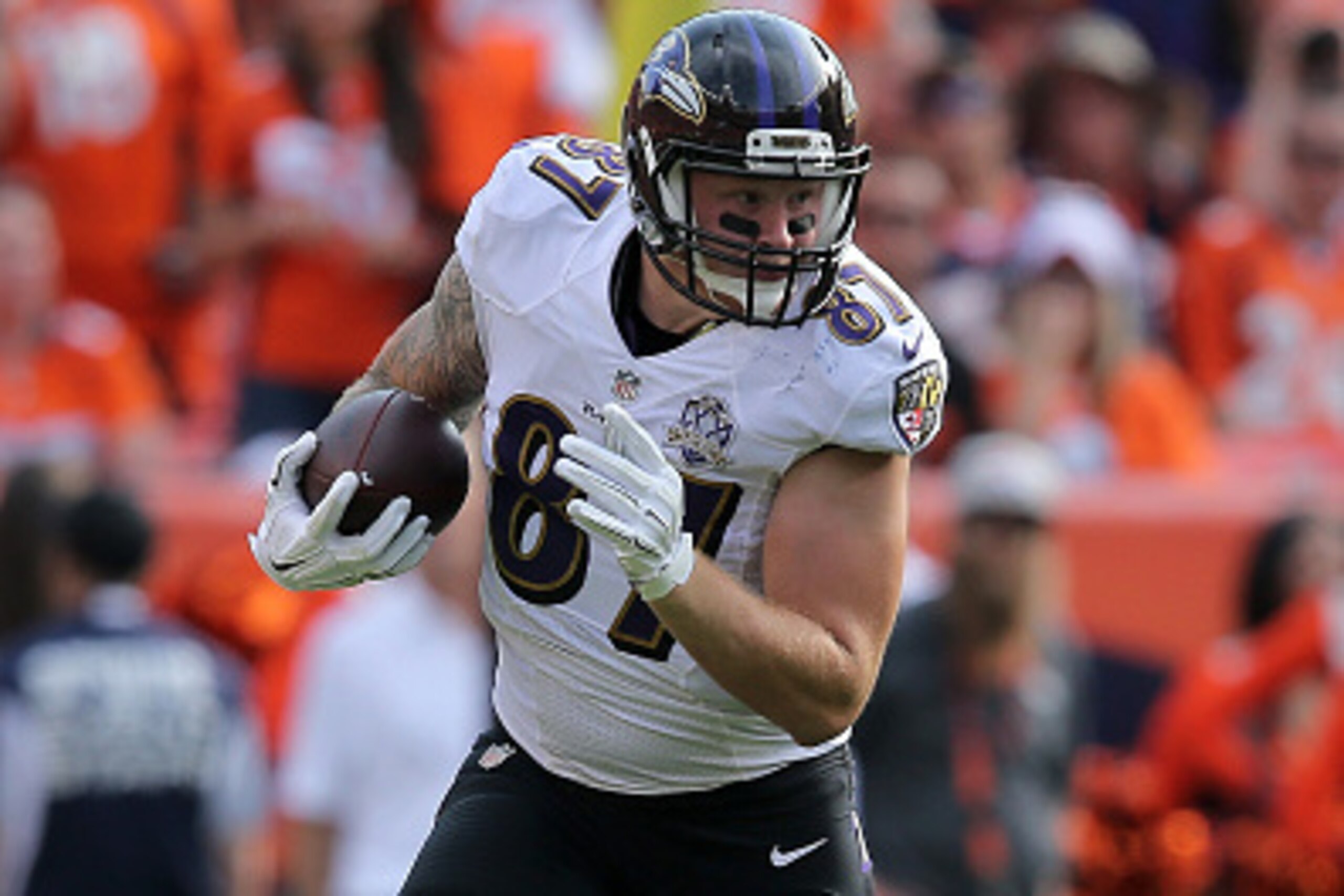 DENVER, CO - SEPTEMBER 13:  Maxx Williams #87 of the Baltimore Ravens makes a pass reception and carries the ball against the Denver Broncos at Sports Authority Field at Mile High on September 13, 2015 in Denver, Colorado. The Broncos defeated the Ravens 