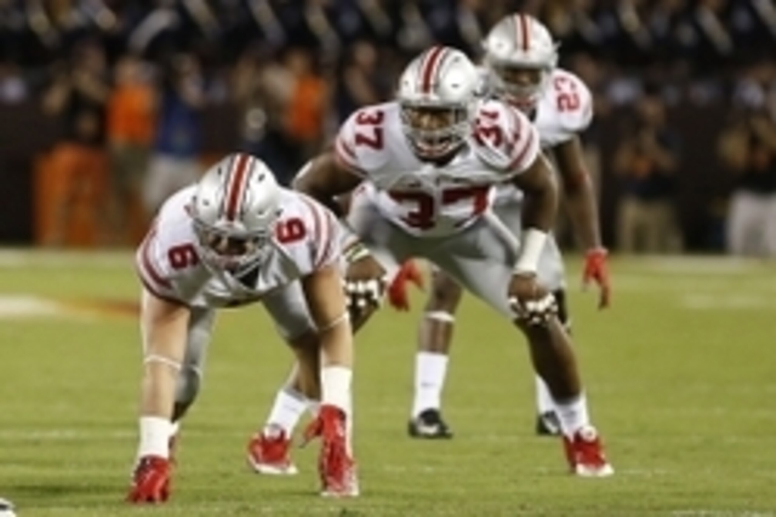 Sep 7, 2015; Blacksburg, VA, USA; Ohio State Buckeyes defensive end Sam Hubbard (6), Buckeyes linebacker Joshua Perry (37), and Buckeyes safety Tyvis Powell (23) line up against the Virginia Tech Hokies at Lane Stadium. Mandatory Credit: Geoff Burke-USA T