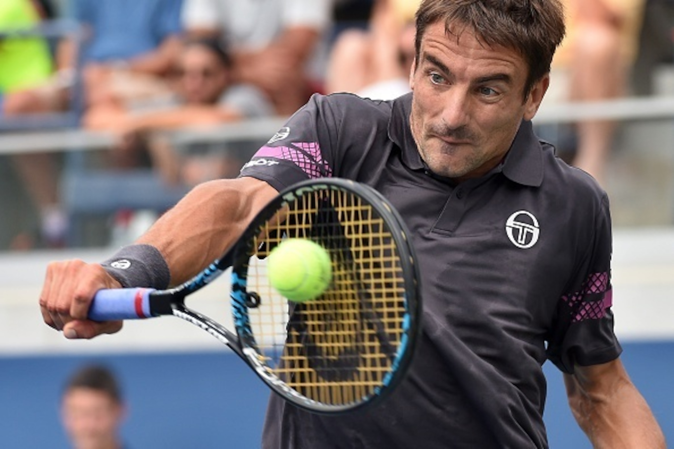 Tommy Robredo of Spain returns the ball to Benoit Paire of France during their 2015 US Open men's singles round 3 match at USTA Billie Jean King National Tennis Center in New York on September 4, 2015. AFP PHOTO/JEWEL SAMAD        (Photo credit should rea