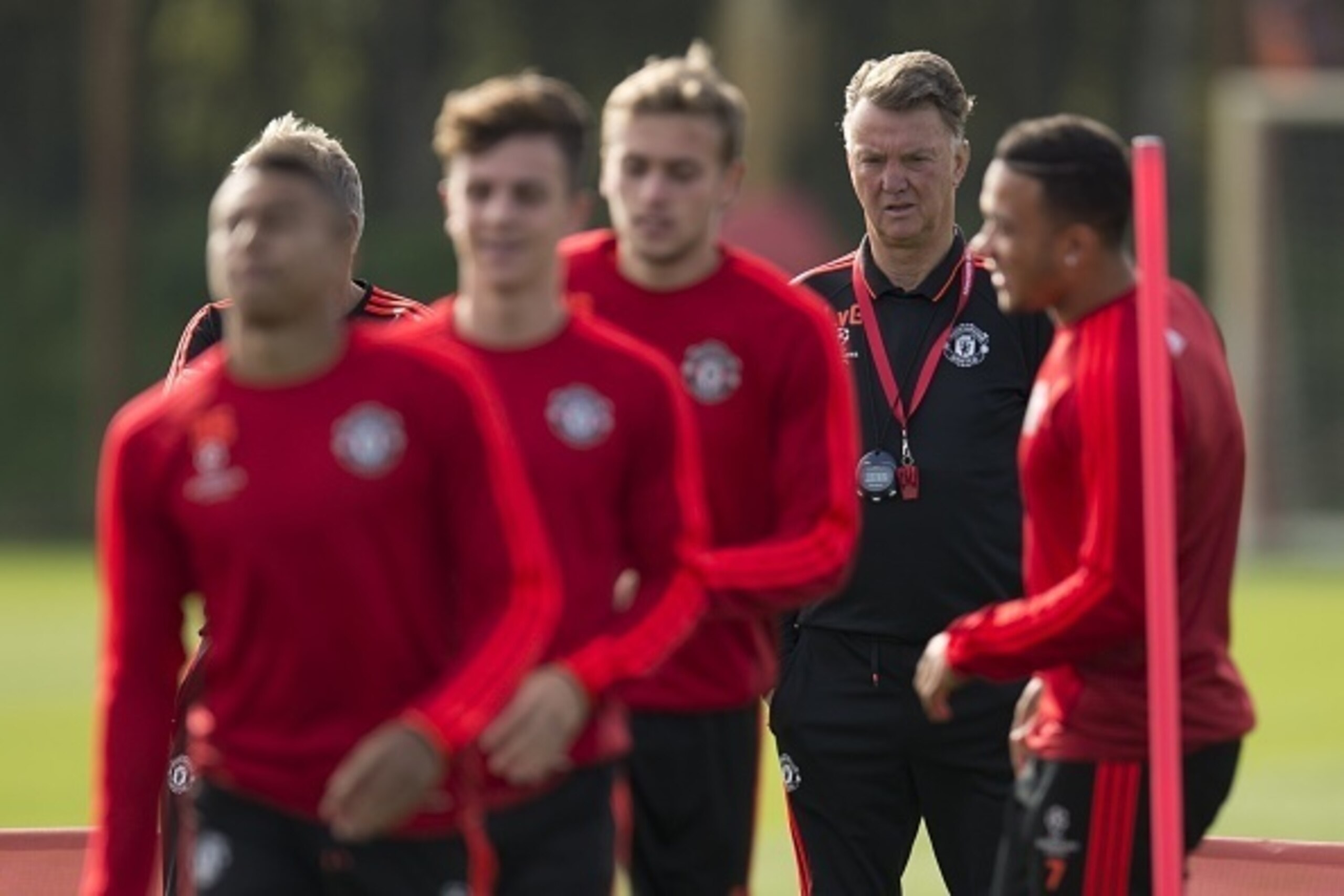Manchester United's Dutch manager Louis van Gaal (2nd R) takes a team training session at their Carrington training complex in Manchester, north west England on September 29, 2015, ahead of their UEFA Champions League, Group B football match against VfL W