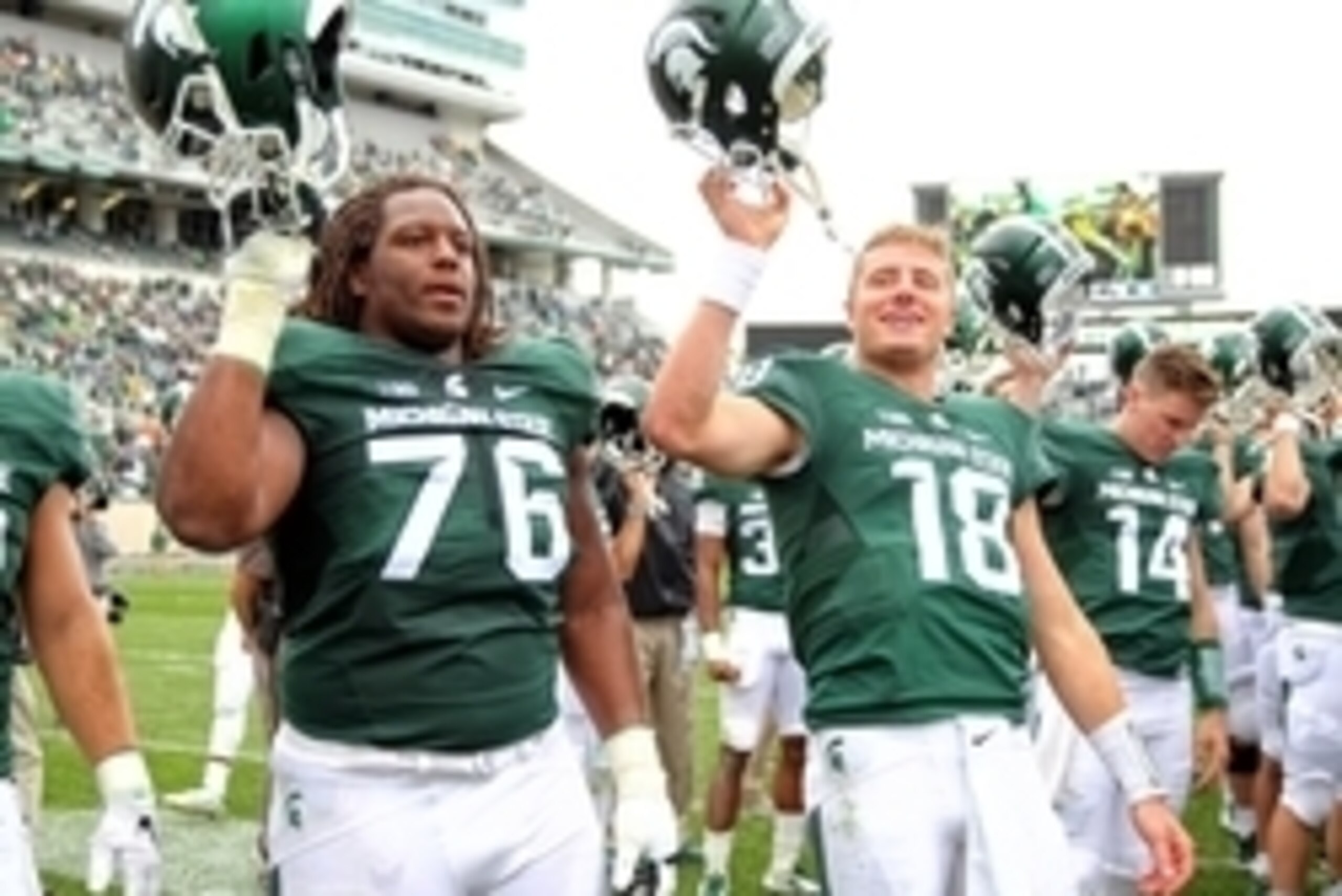 Sep 19, 2015; East Lansing, MI, USA; Michigan State Spartans offensive lineman Donavon Clark (76) and Michigan State Spartans quarterback Connor Cook (18) celebrate win after a game at Spartan Stadium. Mandatory Credit: Mike Carter-USA TODAY Sports Sep 19, 2015; East Lansing, MI, USA; Michigan State Spartans offensive lineman Donavon Clark (76) and Michigan State Spartans quarterback Connor Cook (18) celebrate win after a game at Spartan Stadium. Mandatory Credit: Mike Carter-USA TODAY Sports