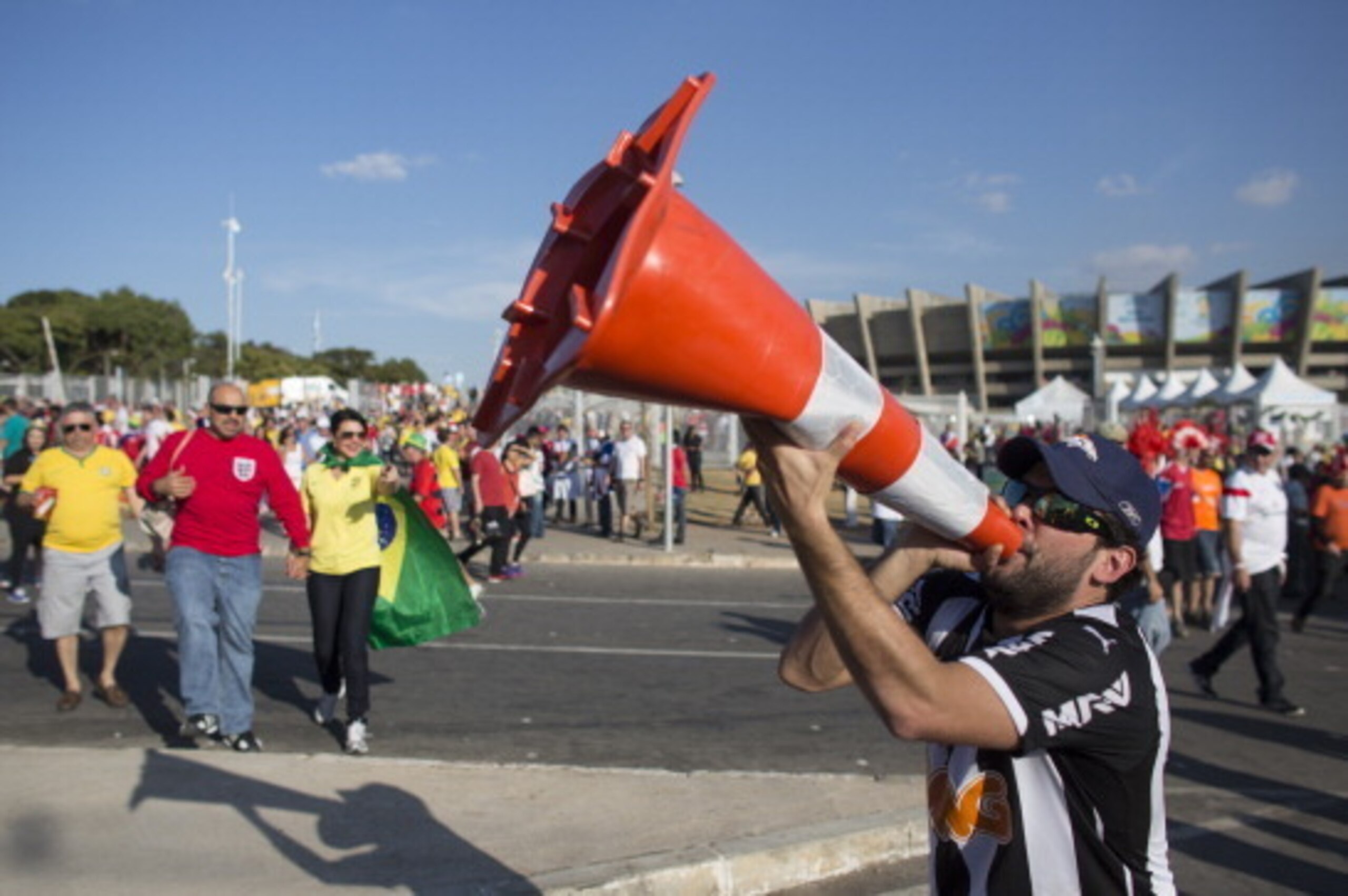 BELO HORIZONTE, BRAZIL - JUNE 24: A football fan shouts through a road cone outside the Mineirao Stadium after watching England play Costa Rica on June 24, 2014 in Belo Horizonte, Brazil. England drew 0-0 with Costa Rica in their final game of Group D in 