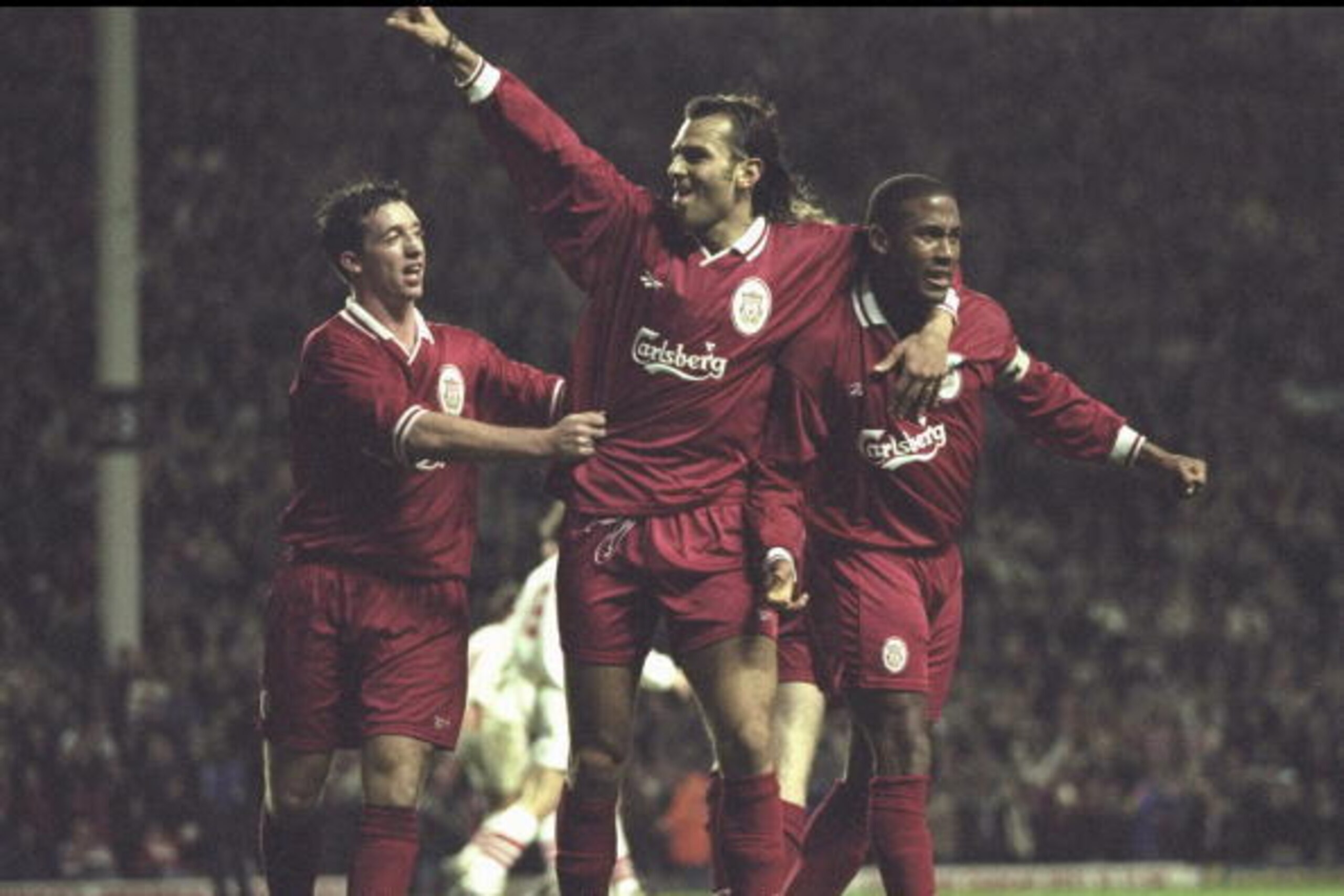 31 Oct 1996:  (left-right) Robbie Fowlre and Patrik Bergr celebrate with John Barnes after his goal during the European Cup Winners Cup second leg tie between Liverpool and FC Sion at Anfield in Liverpool. Liverpool won 6-3. Mandatory Credit: Ben Radford/