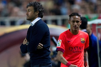 SEVILLE, SPAIN - APRIL 11: Head coach Luis Enrique Martinez (L) of FC Barcelona looks on as his player Neymar JR. (R) is relevated during the La Liga match between Sevilla FC and FC Barcelona at Estadio Ramon Sanchez Pizjuan on April 11, 2015 in Seville, 
