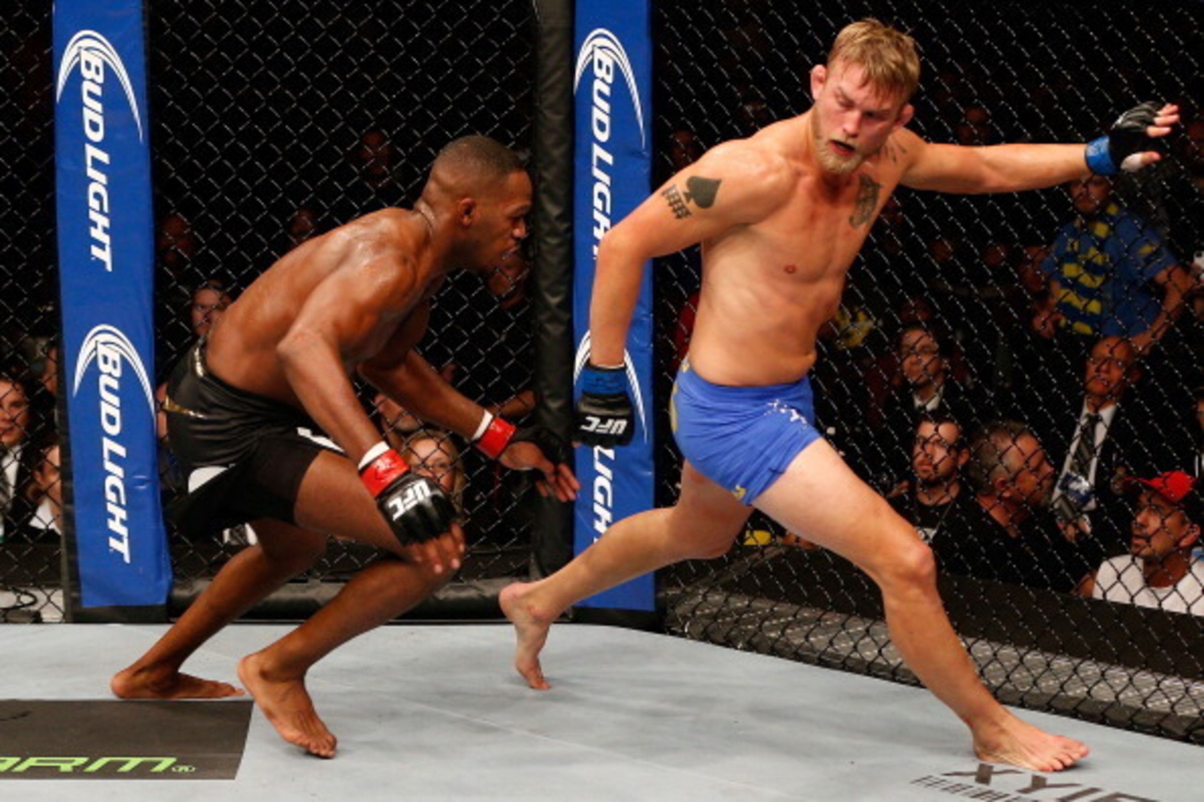 TORONTO, CANADA - SEPTEMBER 21:  (L-R) Jon 'Bones' Jones chases Alexander 'The Mauler' Gustafsson in their UFC light heavyweight championship bout at the Air Canada Center on September 21, 2013 in Toronto, Ontario, Canada. (Photo by Josh Hedges/Zuffa LLC/