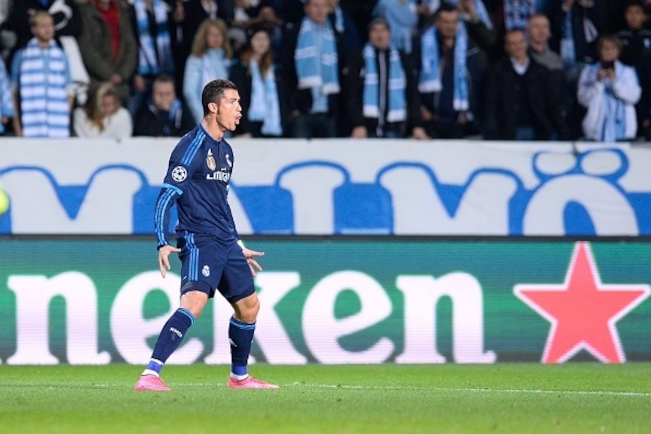 Real Madrid's Portuguese forward Cristiano Ronaldo celebrates after scoring the opening goal during the UEFA Champions League first-leg Group A football match between Malmo FF and Real Madrid CF at the Swedbank Stadion, in Malmo, Sweden on September 30, 2