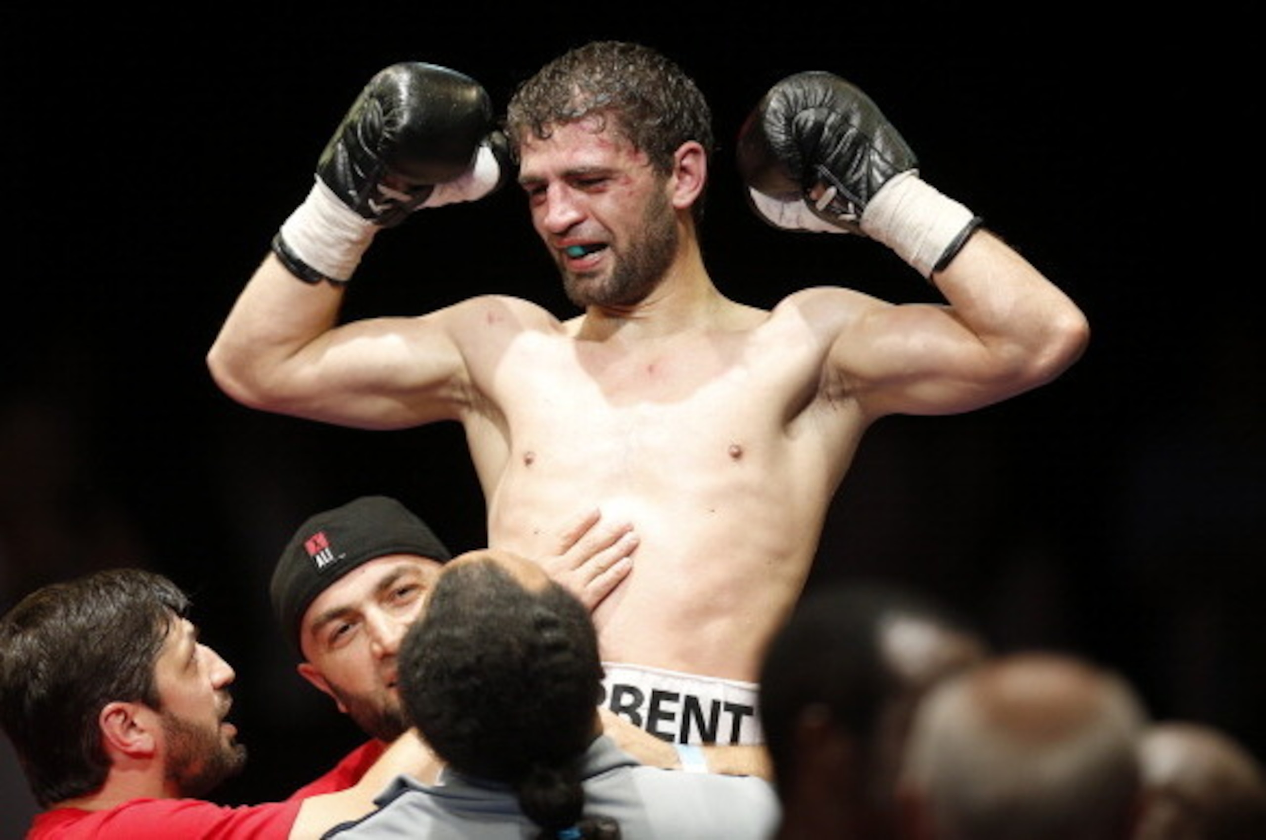 Russian super lightweight world title holder Khabib Allakhverdiev celebrates after defeating French Souleymane M'Baye after their superlight WBA boxing match, on July 13, 2013 in Monaco. AFP PHOTO / VALERY HACHE        (Photo credit should read VALERY HAC