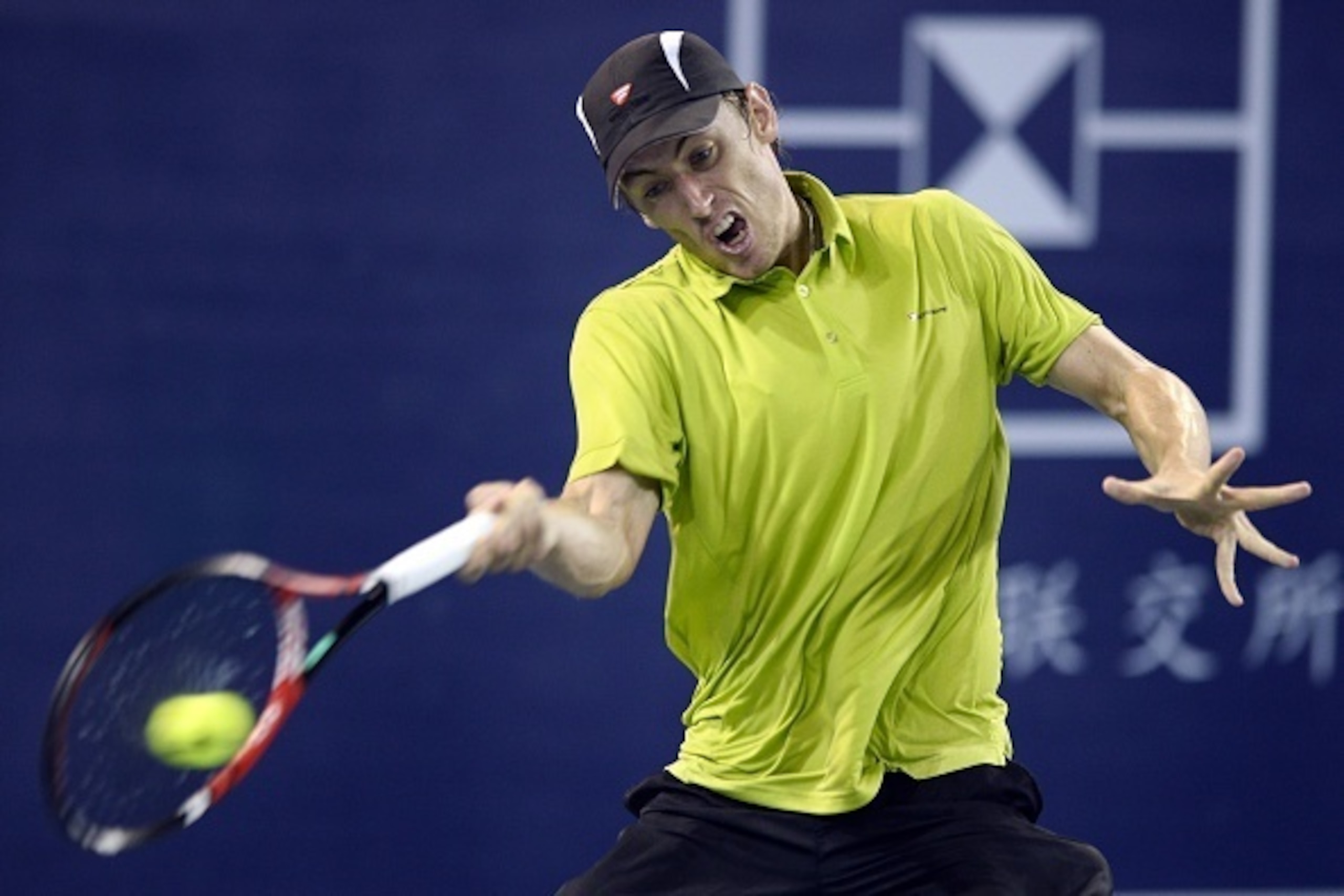 John Millman of Australia returns a shot against Marin Cilic of Croatia during the quarterfinal match at the Shenzhen Open tennis championship in Shenzhen, southern China's Guangdong province on October 1, 2015.                                   CHINA OUT