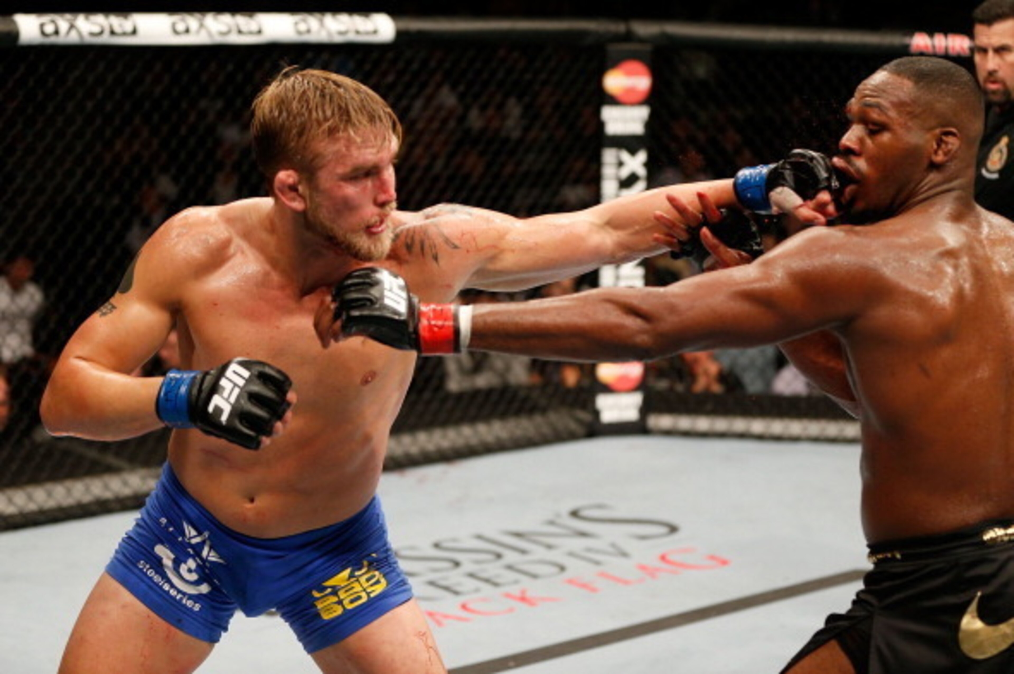 TORONTO, CANADA - SEPTEMBER 21:  (L-R) Alexander 'The Mauler' Gustafsson punches Jon 'Bones' Jones in their UFC light heavyweight championship bout at the Air Canada Center on September 21, 2013 in Toronto, Ontario, Canada. (Photo by Josh Hedges/Zuffa LLC