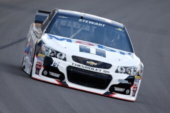 BROOKLYN, MI - AUGUST 14:  Tony Stewart, driver of the #14 Mobil 1/Bass Pro Shops Chevrolet, drives during qualifying for the NASCAR Sprint Cup Series Pure Michigan 400 at Michigan International Speedway on August 14, 2015 in Brooklyn, Michigan.  (Photo b