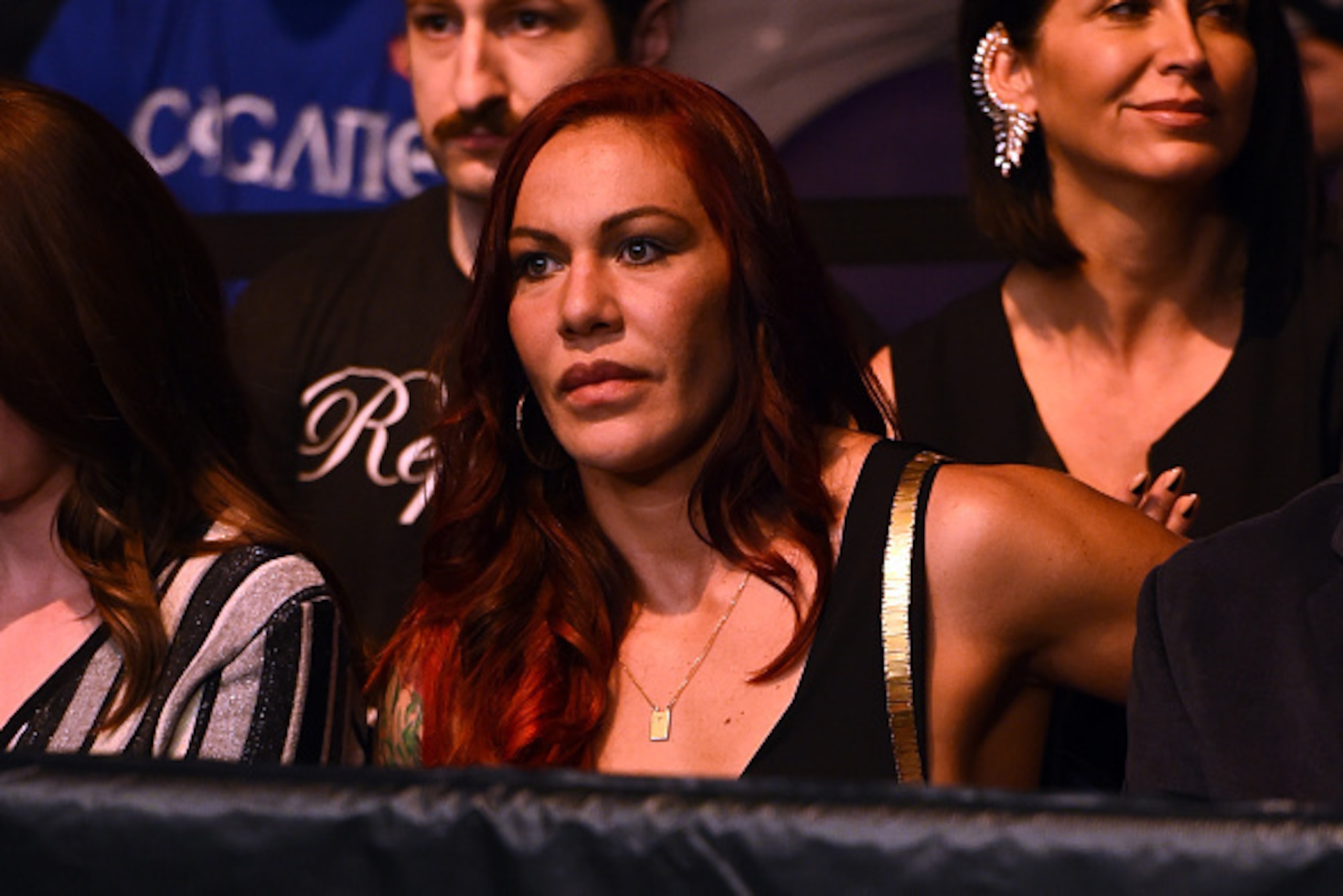 PHOENIX, AZ - DECEMBER 13:  Cristiane 'Cyborg' Justino sits Octagonside during the UFC Fight Night event at the U.S. Airways Center on December 13, 2014 in Phoenix, Arizona.  (Photo by Josh Hedges/Zuffa LLC/Zuffa LLC via Getty Images)
