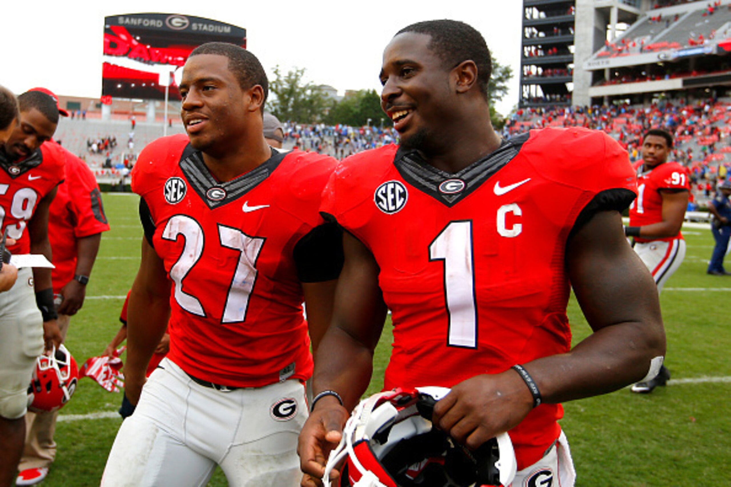 ATHENS, GA - SEPTEMBER 26: Running back Nick Chubb #27 of the Georgia Bulldogs celebrates with running back Sony Michel #1 at the conclusion of the game against the Southern University Jaguars on September 26, 2015 at Sanford Stadium in Athens, Georgia. T