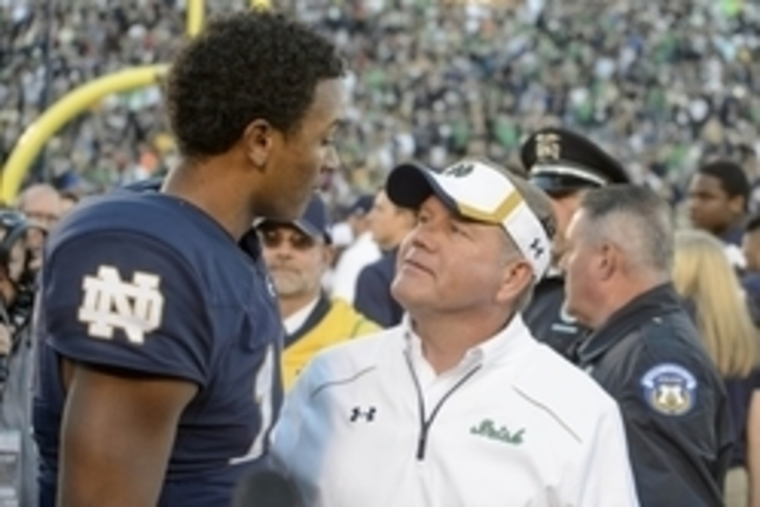 Sep 19, 2015; South Bend, IN, USA; Notre Dame Fighting Irish head coach Brian Kelly and quarterback DeShone Kizer (14) chat after Notre Dame defeated the Georgia Tech Yellow Jackets 30-22 at Notre Dame Stadium. Mandatory Credit: Matt Cashore-USA TODAY Spo