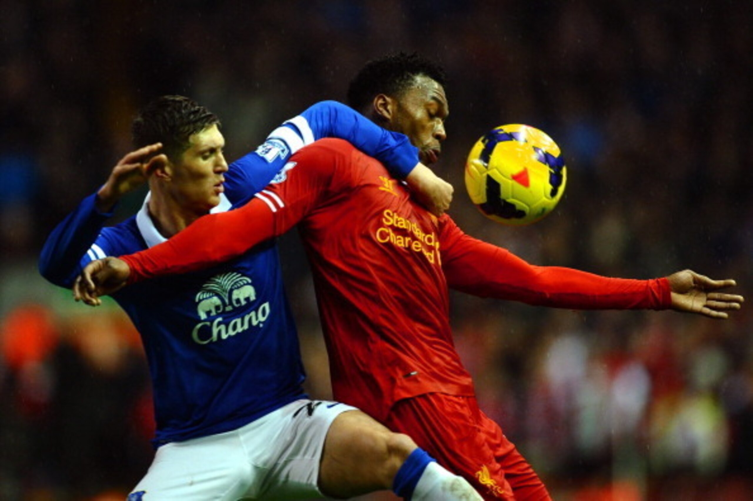 LIVERPOOL, ENGLAND - JANUARY 28:  Daniel Sturridge of Liverpool attempts to control the ball under pressure from John Stones of Everton during the Barclays Premier League match between Liverpool and Everton at Anfield on January 28, 2014 in Liverpool, Eng