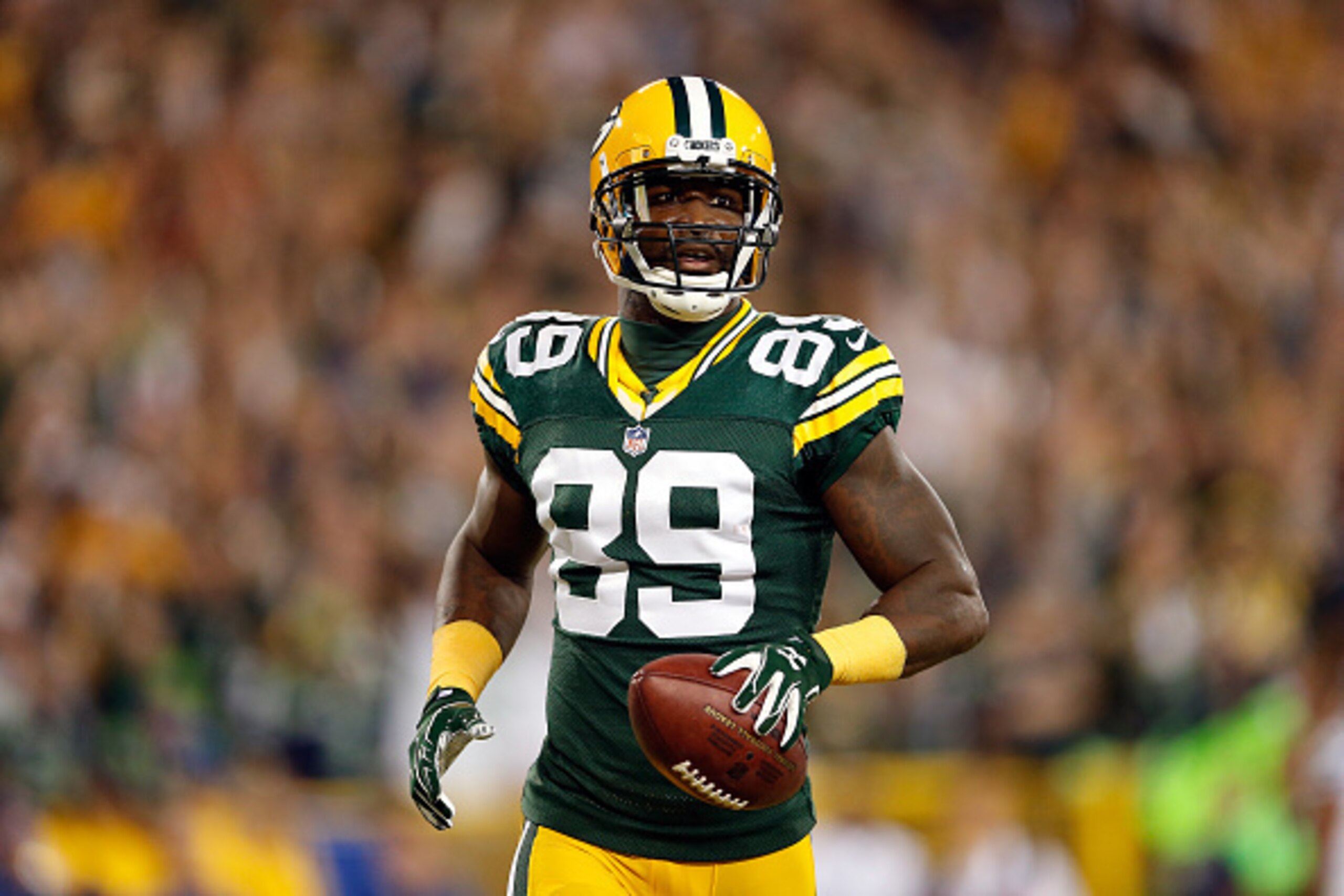 GREEN BAY, WI - SEPTEMBER 20:  James Jones #89 of the Green Bay Packers celebrates after scoring a touchdown thrown by Aaron Rodgers #12 in the first quarter against the Seattle Seahawks during their game at Lambeau Field on September 20, 2015 in Green Ba