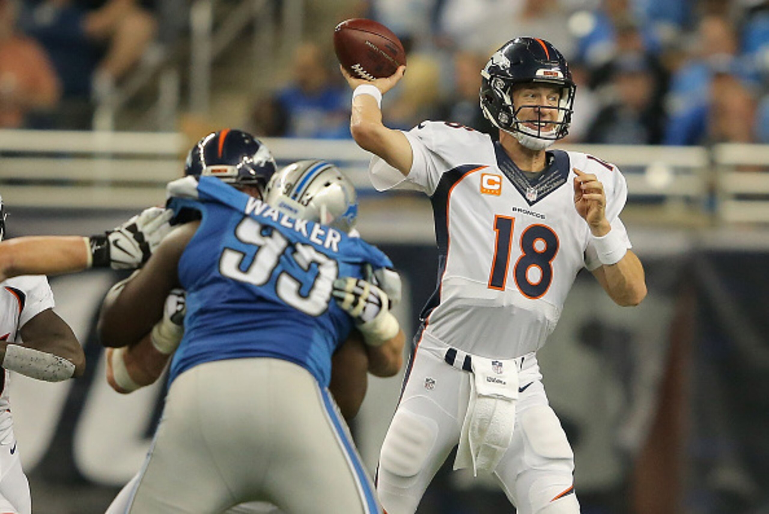 DETROIT, MI - SEPTEMBER 27: Peyton Manning #18 of the Denver Broncos throws a second quarter pass against the Detroit Lions at Ford Field on September 27, 2014 in Detroit, Michigan. (Photo by Doug Pensinger/Getty Images)