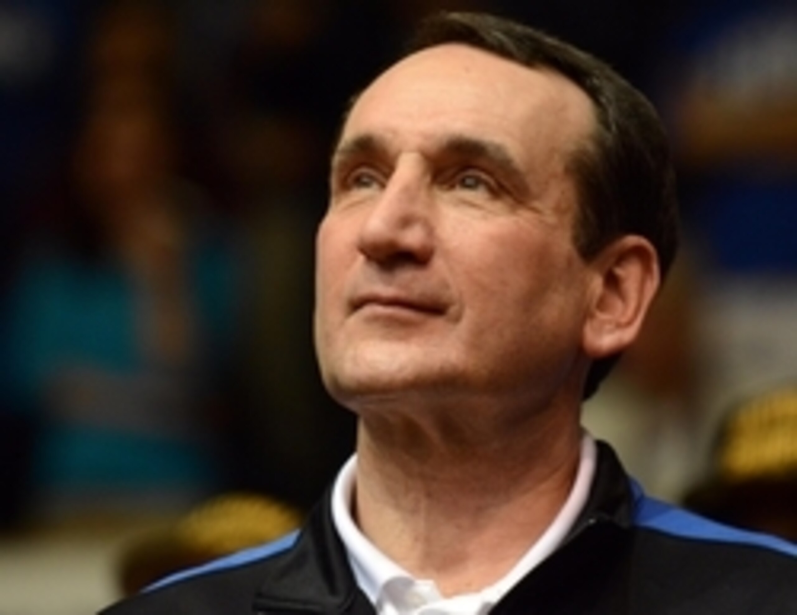 Apr 7, 2015; Durham, NC, USA; Duke Blue Devils head coach Mike Krzyzewski watches a highlight video during a welcome home ceremony at Cameron Indoor Stadium. Mandatory Credit: Rob Kinnan-USA TODAY Sports