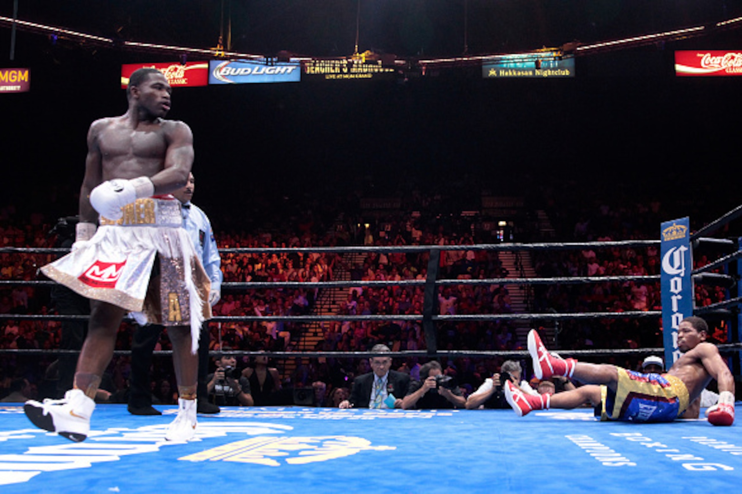LAS VEGAS, NV - JUNE 20:  Adrien Broner (L) heads to a neutral corner after knocking down Shawn Porter during their welterweight fight at MGM Grand Garden Arena on June 20, 2015 in Las Vegas, Nevada. Porter recovered and won the fight by unanimous decisio