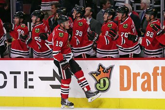 CHICAGO, IL - SEPTEMBER 22: Jonathan Toews #19 of the Chicago Blackhawks is congratulated by teammates after scoring a 1st period goal against the Detroit Red Wings during a preseason game at the United Center on September 22, 2015 in Chicago, Illinois. CHICAGO, IL - SEPTEMBER 22: Jonathan Toews #19 of the Chicago Blackhawks is congratulated by teammates after scoring a 1st period goal against the Detroit Red Wings during a preseason game at the United Center on September 22, 2015 in Chicago, Illinois.