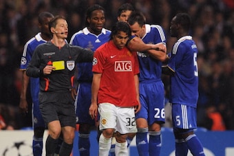 MOSCOW - MAY 21:  John Terry of Chelsea confronts Carlos Tevez of Manchester United during the UEFA Champions League Final match between Manchester United and Chelsea at the Luzhniki Stadium on May 21, 2008 in Moscow, Russia.  (Photo by Shaun Botterill/Ge