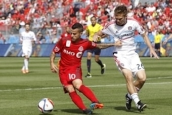 Sep 26, 2015; Toronto, Ontario, CAN; Toronto FC forward Sebastian Giovinco (10) tries to get away from Chicago Fire midfielder Michael Stephens (26) during the first half at BMO Field. Mandatory Credit: John E. Sokolowski-USA TODAY Sports Sep 26, 2015; Toronto, Ontario, CAN; Toronto FC forward Sebastian Giovinco (10) tries to get away from Chicago Fire midfielder Michael Stephens (26) during the first half at BMO Field. Mandatory Credit: John E. Sokolowski-USA TODAY Sports