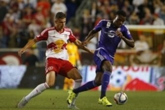 Sep 25, 2015; Harrison, NJ, USA; Orlando City SC forward Cyle Larin (21) dribble away from New York Red Bulls defender Matt Miazga (20) during first half at Red Bull Arena. Mandatory Credit: Noah K. Murray-USA TODAY Sports Sep 25, 2015; Harrison, NJ, USA; Orlando City SC forward Cyle Larin (21) dribble away from New York Red Bulls defender Matt Miazga (20) during first half at Red Bull Arena. Mandatory Credit: Noah K. Murray-USA TODAY Sports