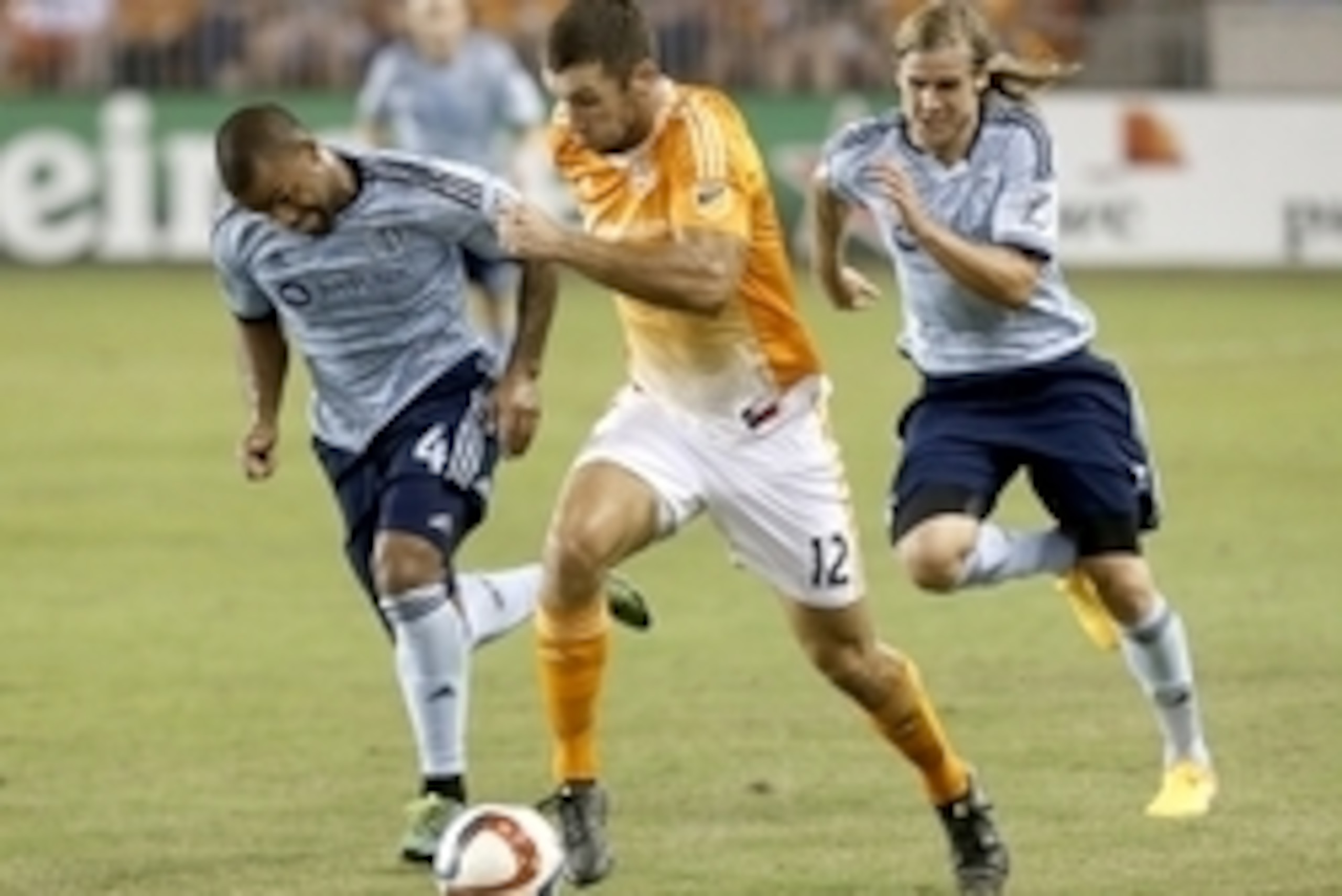 Sep 23, 2015; Houston, TX, USA; Houston Dynamo forward Will Bruin (12) dribbles against Sporting KC defender Kevin Ellis (4) in the second half at BBVA Compass Stadium. Dynamo won 1 to 0. Mandatory Credit: Thomas B. Shea-USA TODAY Sports Sep 23, 2015; Houston, TX, USA; Houston Dynamo forward Will Bruin (12) dribbles against Sporting KC defender Kevin Ellis (4) in the second half at BBVA Compass Stadium. Dynamo won 1 to 0. Mandatory Credit: Thomas B. Shea-USA TODAY Sports