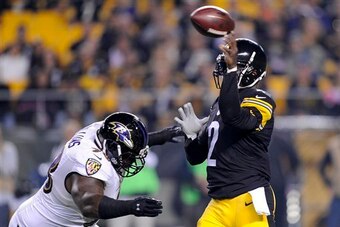 Vick often had trouble finding receivers downfield, and he ended up taking five sacks.