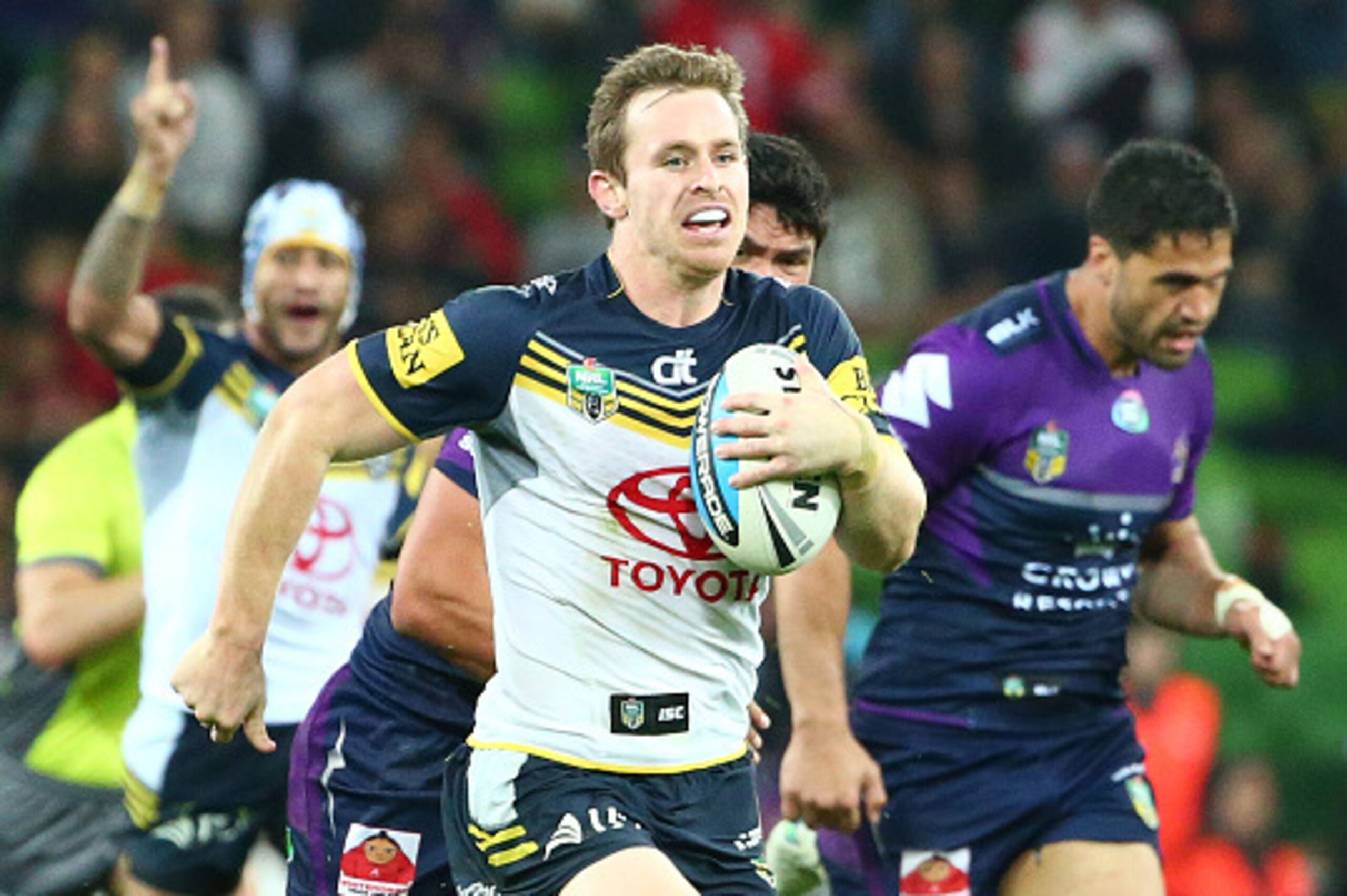 MELBOURNE, AUSTRALIA - SEPTEMBER 26: Michael Morgan of the Cowboys runs away to score a try during the NRL Second Preliminary Final match between the Melbourne Storm and the North Queensland Cowboys at AAMI Park on September 26, 2015 in Melbourne, Austra MELBOURNE, AUSTRALIA - SEPTEMBER 26: Michael Morgan of the Cowboys runs away to score a try during the NRL Second Preliminary Final match between the Melbourne Storm and the North Queensland Cowboys at AAMI Park on September 26, 2015 in Melbourne, Austra