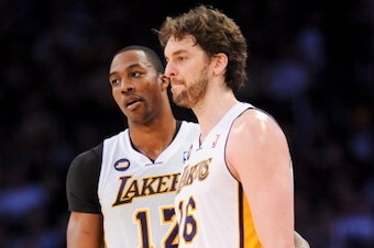 LOS ANGELES, CA - APRIL 14: Dwight Howard #12 and Pau Gasol #16 of the Los Angeles Lakers look on during their game against the San Antonio Spurs at Staples Center on April 14, 2013 in Los Angeles, California. NOTE TO USER: User expressly acknowledges and