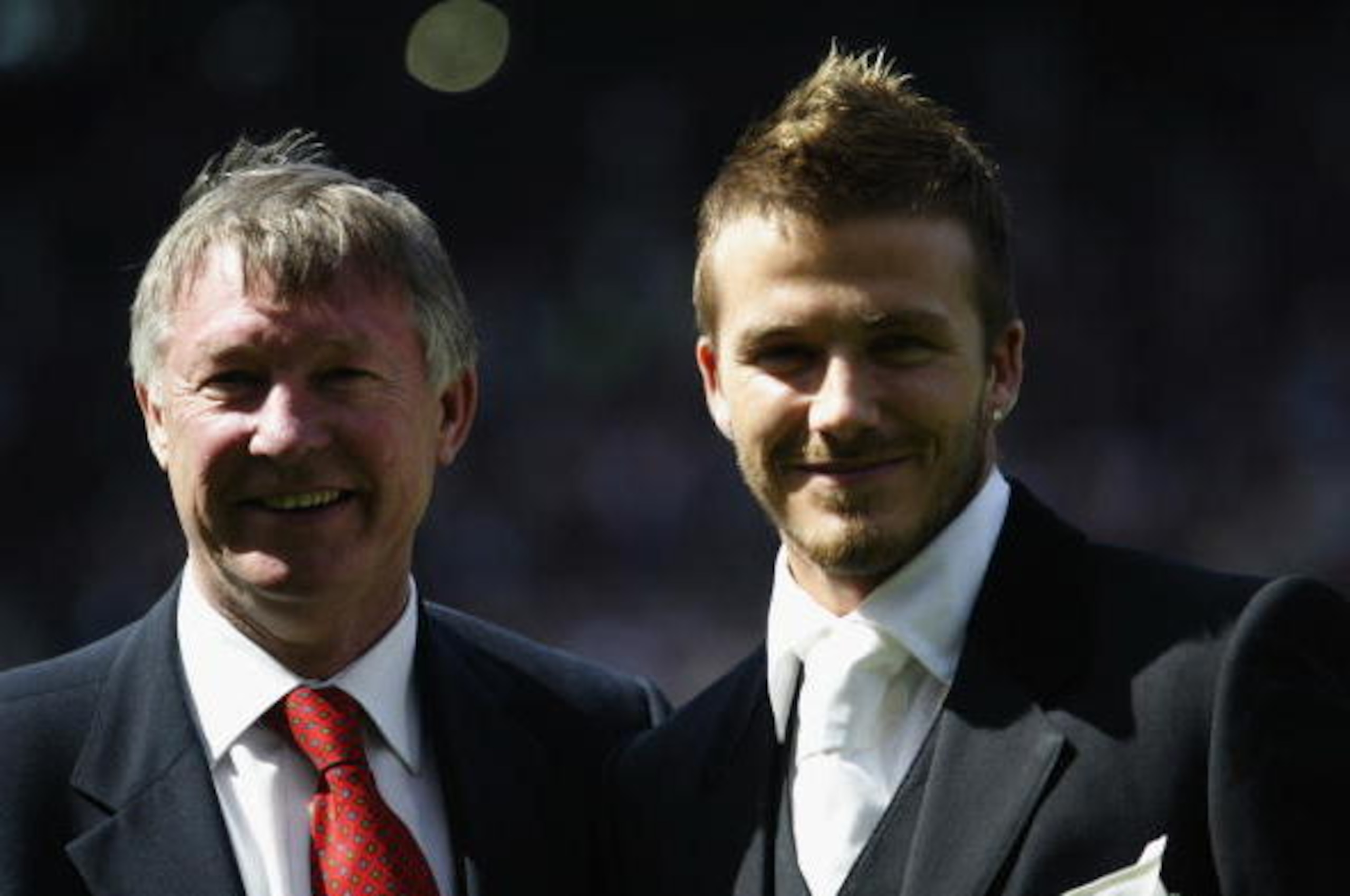MANCHESTER - MAY 11:  David Beckham of Manchester United and manager Alex Ferguson stand next to each other on the pitch after Beckham signed a new lucrative contract to stay at the club before the FA Barclaycard Premiership match between Manchester Unite