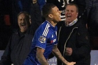 Chelsea's Brazilian striker Kenedy celebrates after scoring their third goal during the English League Cup third round football match between Walsall and Chelsea at The Banks's Stadium in Walsall, central England on September 23, 2015. AFP PHOTO / LINDSEY