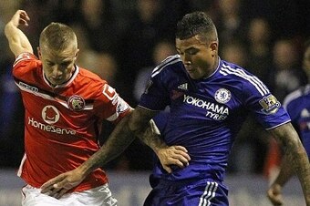Walsall's Cypriot defender Jason Demetriou (L) vies with Chelsea's Brazilian striker Kenedy during the English League Cup third round football match between Walsall and Chelsea at The Banks's Stadium in Walsall, central England on September 23, 2015. AFP 