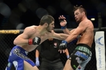 May 23, 2015; Las Vegas, NV, USA; Islam Makhachev (red gloves) and Leo Kuntz (blue gloves) fight during their lightweight bout during UFC 187 at MGM Grand Garden Arena.  won via second round submission. Mandatory Credit: Joe Camporeale-USA TODAY Sports