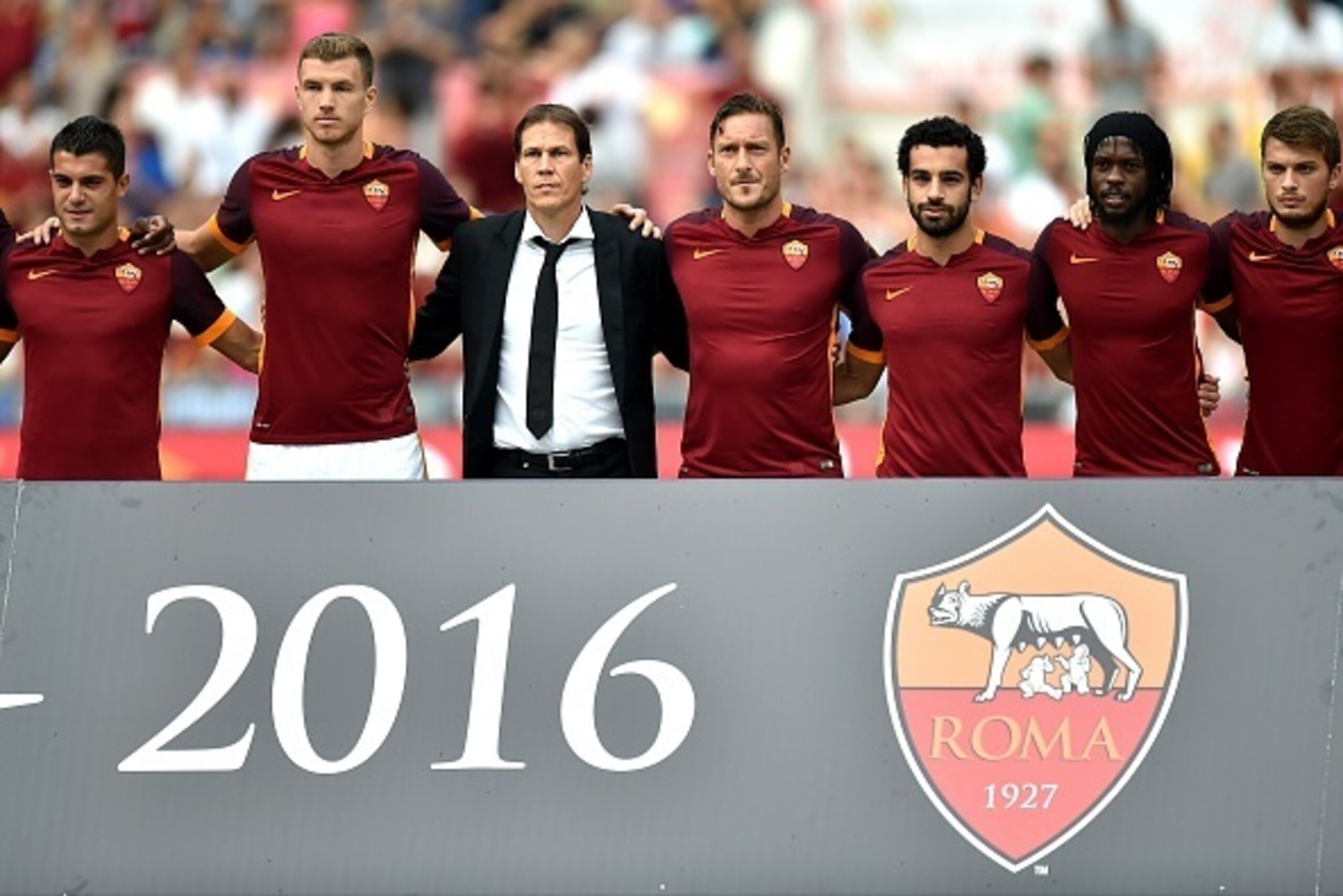 (L-R) AS Roma's Spanish forward Iago Falque, Bosnian forward Edin Dzeko, French coach Rudi Garcia, Italian forward Francesco Totti, Egyptian midfielder Mohamed Salah, Ivorian forward Gervinho, and Serbian forward Adem Ljajic pose before a friendly footbal