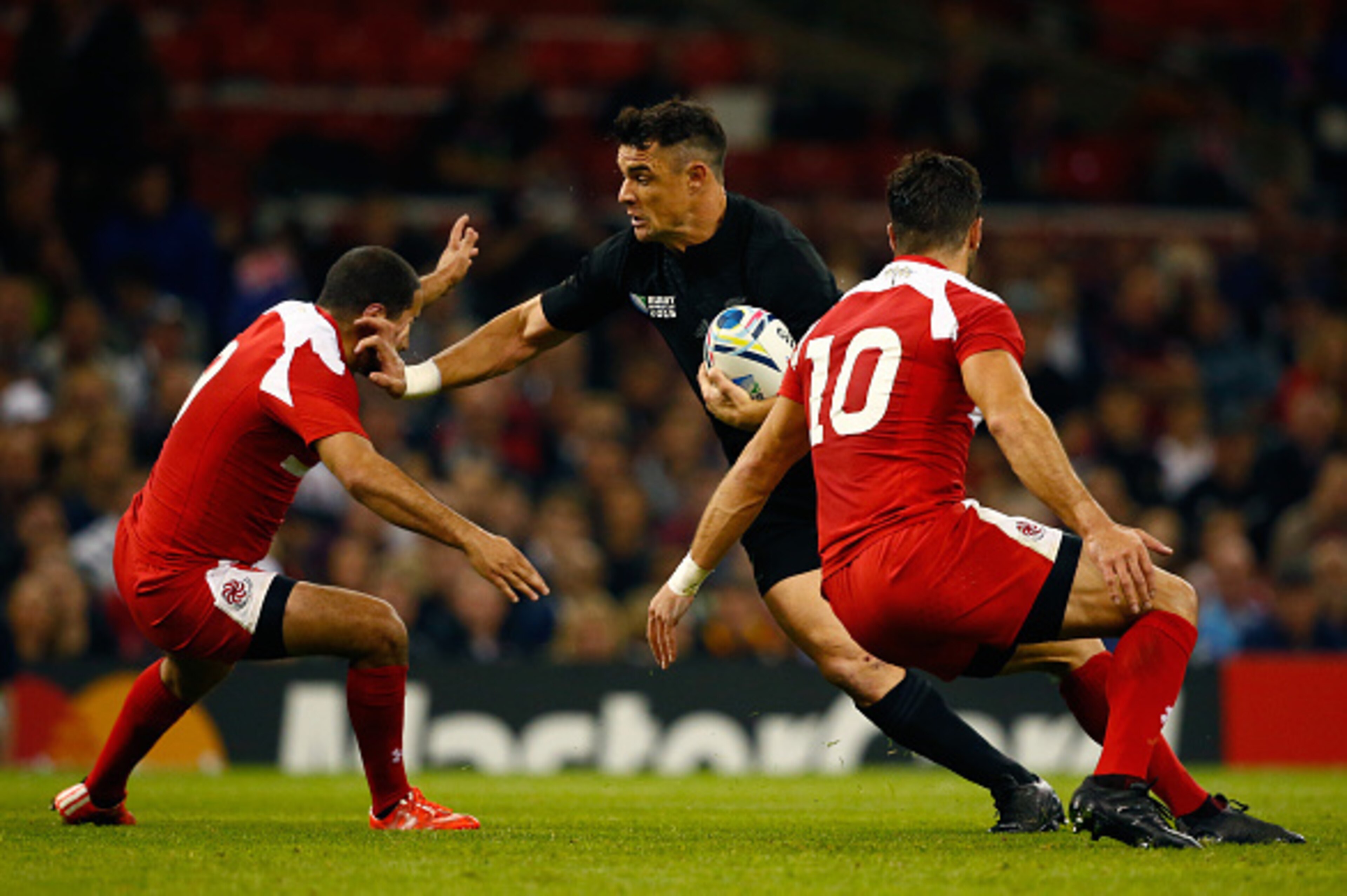 CARDIFF, WALES - OCTOBER 02: Dan Carter of the New Zealand All Blacks is stopped by Giorgi Begadze (L) and Lasha Malaguradze of Georgia during the 2015 Rugby World Cup Pool C match between New Zealand and Georgia at the Millennium Stadium on October 2, 2 CARDIFF, WALES - OCTOBER 02: Dan Carter of the New Zealand All Blacks is stopped by Giorgi Begadze (L) and Lasha Malaguradze of Georgia during the 2015 Rugby World Cup Pool C match between New Zealand and Georgia at the Millennium Stadium on October 2, 2