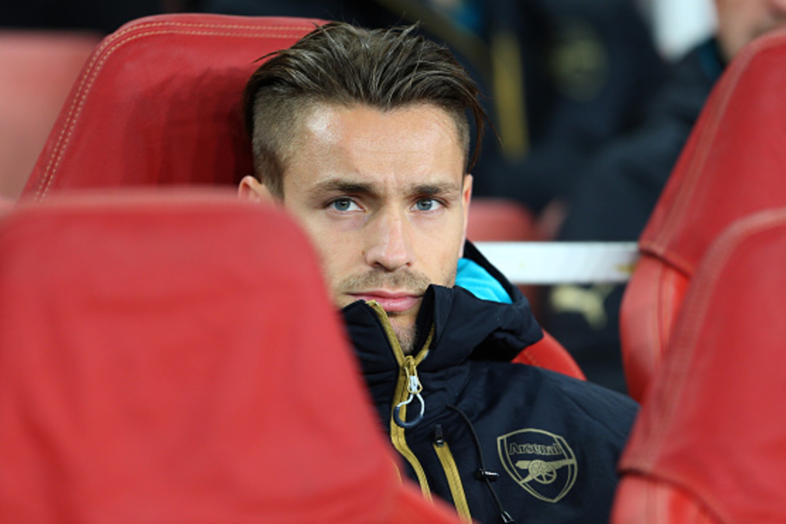LONDON, ENGLAND - SEPTEMBER 29:  Mathieu Debuchy of Arsenal on the bench before the UEFA Champions League match between Arsenal and Olympiacos at the Emirates Stadium on September 29, 2015 in London, United Kingdom.  (Photo by Catherine Ivill - AMA/Getty 