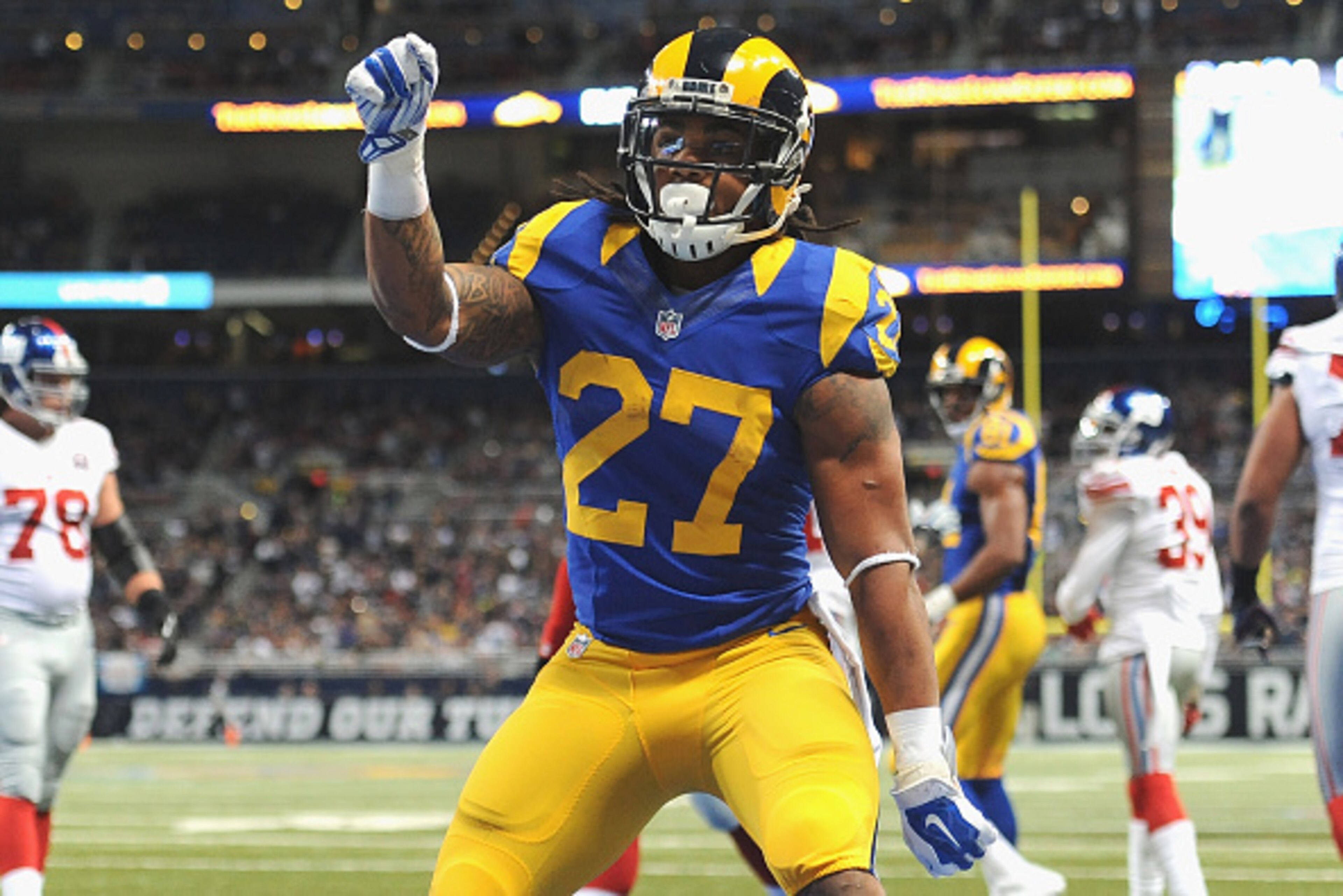 ST. LOUIS, MO - DECEMBER 21: Tre Mason #27 of the St. Louis Rams celebrates a touchdown against the New York Giants at the Edward Jones Dome on December 21, 2014 in St. Louis, Missouri. (Photo by Michael Thomas/Getty Images)
