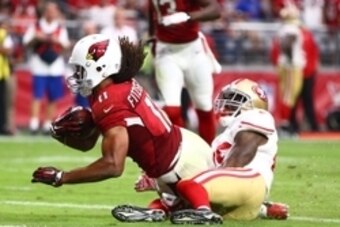 Sep 27, 2015; Glendale, AZ, USA; Arizona Cardinals wide receiver Larry Fitzgerald (11) dives into the end zone after catching a pass for a touchdown against the San Francisco 49ers at University of Phoenix Stadium. Mandatory Credit: Mark J. Rebilas-USA TO