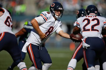 SEATTLE, WA - SEPTEMBER 27:  Quarterback Jimmy Clausen #8 of the Chicago Bears hands off to running back Matt Forte #22 against the Seattle Seahawks at CenturyLink Field on September 27, 2015 in Seattle, Washington.  (Photo by Otto Greule Jr/Getty Images)
