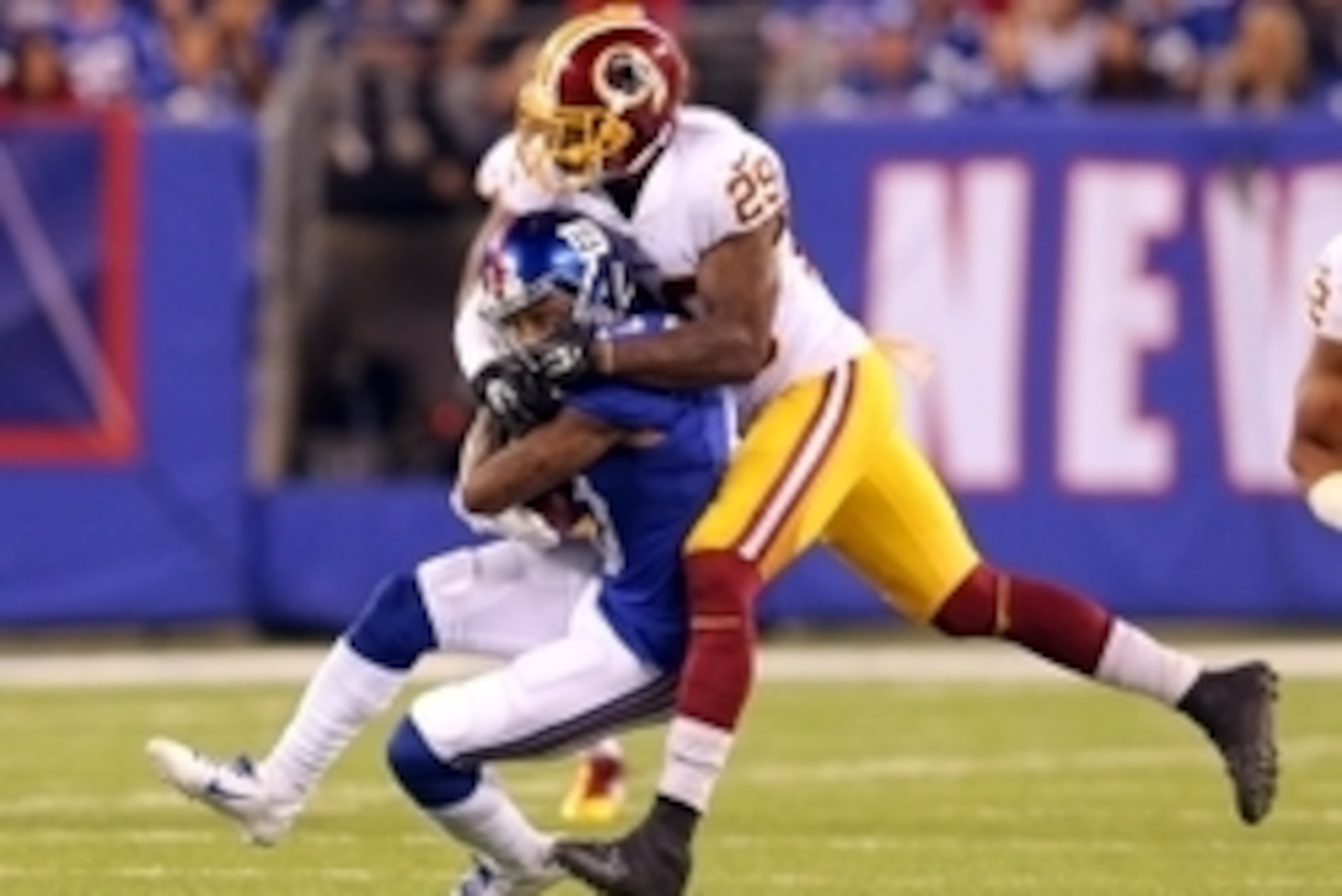 Sep 24, 2015; East Rutherford, NJ, USA; New York Giants wide receiver Odell Beckham Jr. (13) is tackled by Washington Redskins defensive back Chris Culliver (29) during the second quarter at MetLife Stadium. Mandatory Credit: Brad Penner-USA TODAY Sports