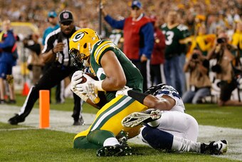 GREEN BAY, WI - SEPTEMBER 20:  Wide receiver Richard Rodgers #82 of the Green Bay Packers catches a touchdown pass in the fourth quarter against the Seattle Seahawks during their game at Lambeau Field on September 20, 2015 in Green Bay, Wisconsin.  The Pa