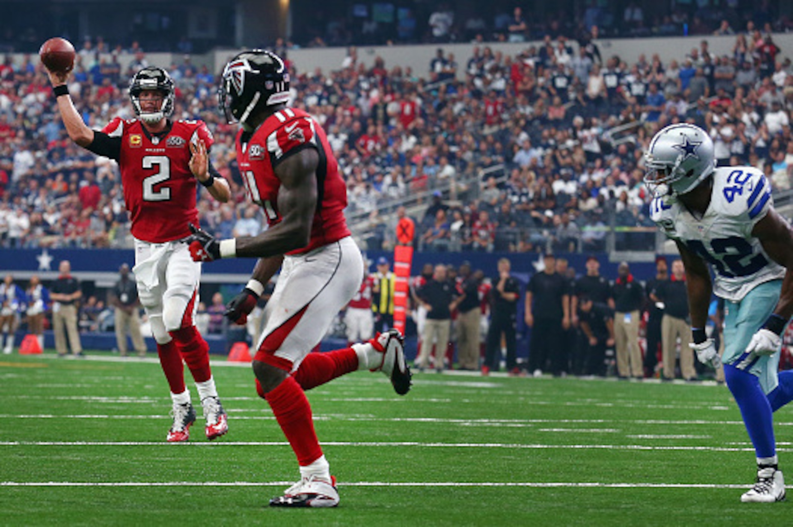 ARLINGTON, TX - SEPTEMBER 27: Matt Ryan #2 of the Atlanta Falcons completes a touchdown pass to Julio Jones #11 of the Atlanta Falcons against Barry Church #42 of the Dallas Cowboys at AT&T Stadium on September 27, 2015 in Arlington, Texas. (Photo by ARLINGTON, TX - SEPTEMBER 27: Matt Ryan #2 of the Atlanta Falcons completes a touchdown pass to Julio Jones #11 of the Atlanta Falcons against Barry Church #42 of the Dallas Cowboys at AT&T Stadium on September 27, 2015 in Arlington, Texas. (Photo by