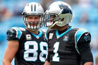 CHARLOTTE, NC - NOVEMBER 16:  Cam Newton #1 and Greg Olsen #88 of the Carolina Panthers warm up before their game against the Atlanta Falcons at Bank of America Stadium on November 16, 2014 in Charlotte, North Carolina.  (Photo by Grant Halverson/Getty Im