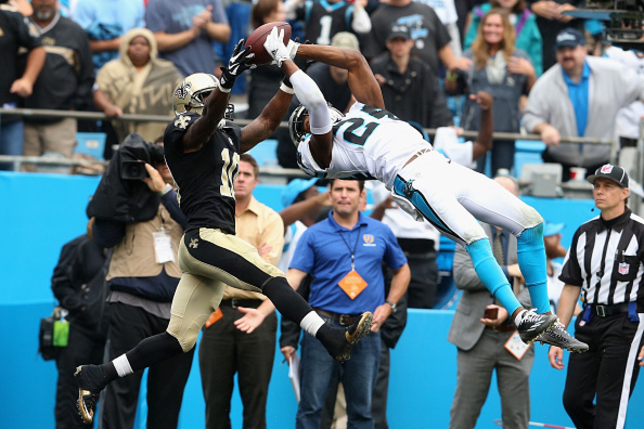 CHARLOTTE, NC - SEPTEMBER 27:  Josh Norman #24 of the Carolina Panthers makes a game saving interception against Brandin Cooks #10 of the New Orleans Saints in the fourth quarter during their game at Bank of America Stadium on September 27, 2015 in Charlo