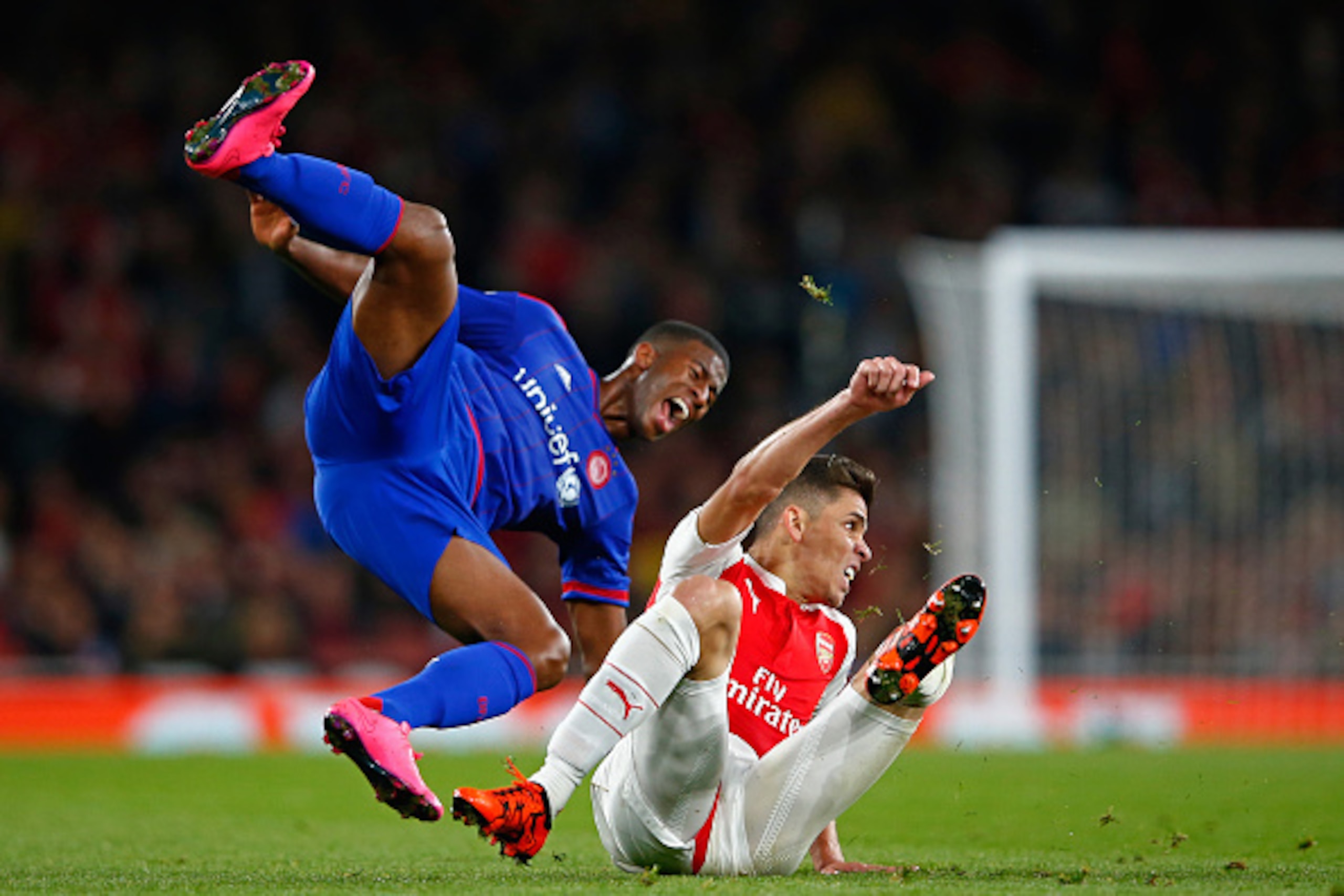LONDON, ENGLAND - SEPTEMBER 29:  Gabriel Paulista of Arsenal challenges Seba of Olympiacos during the UEFA Champions League Group F match between Arsenal FC and Olympiacos FC at the Emirates Stadium on September 29, 2015 in London, United Kingdom.  (Photo